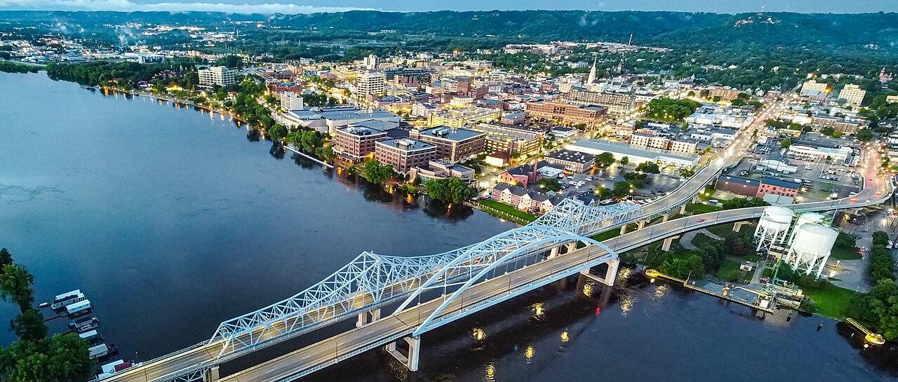 A view of La Crosse, WI with the river, bridge, and city.