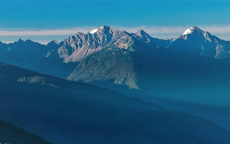Crystal Peak centered and Chimney Peak (right) of the Olympic Mountain Range. View from Hurricane Ridge in Olympic National Park WA