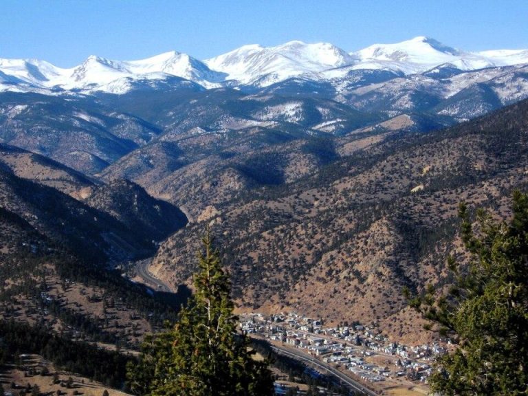 Overlooking Idaho Springs, Colorado, with the continental divide in the background, including Mt. Flora and Mt. Eva on the left and James Peak on the right.
