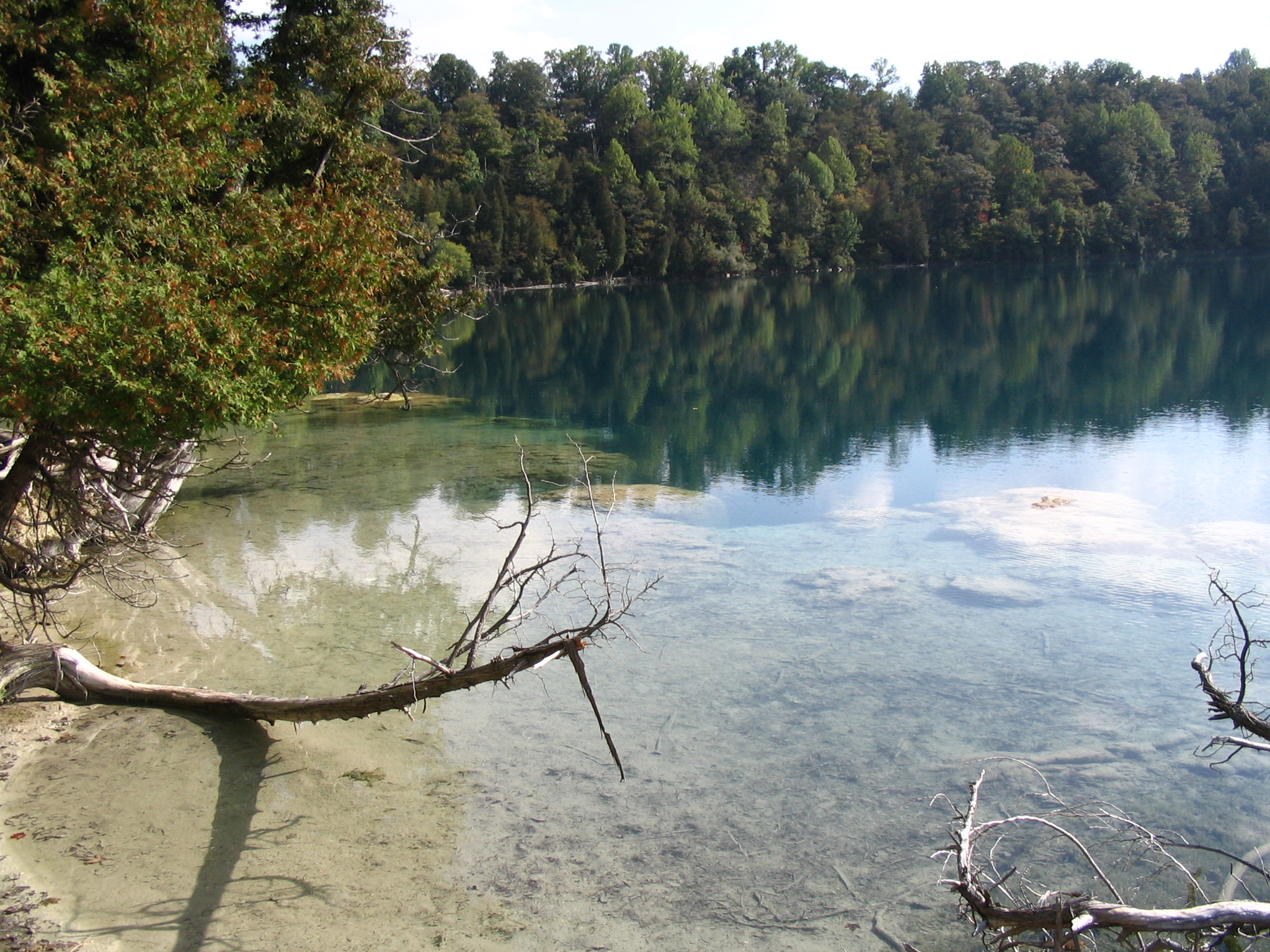Deadman's Point at Green Lake in Green Lakes State Park, New York. "Marl reef", bacteria formed chalky shoreline formations, are visible in the foreground.