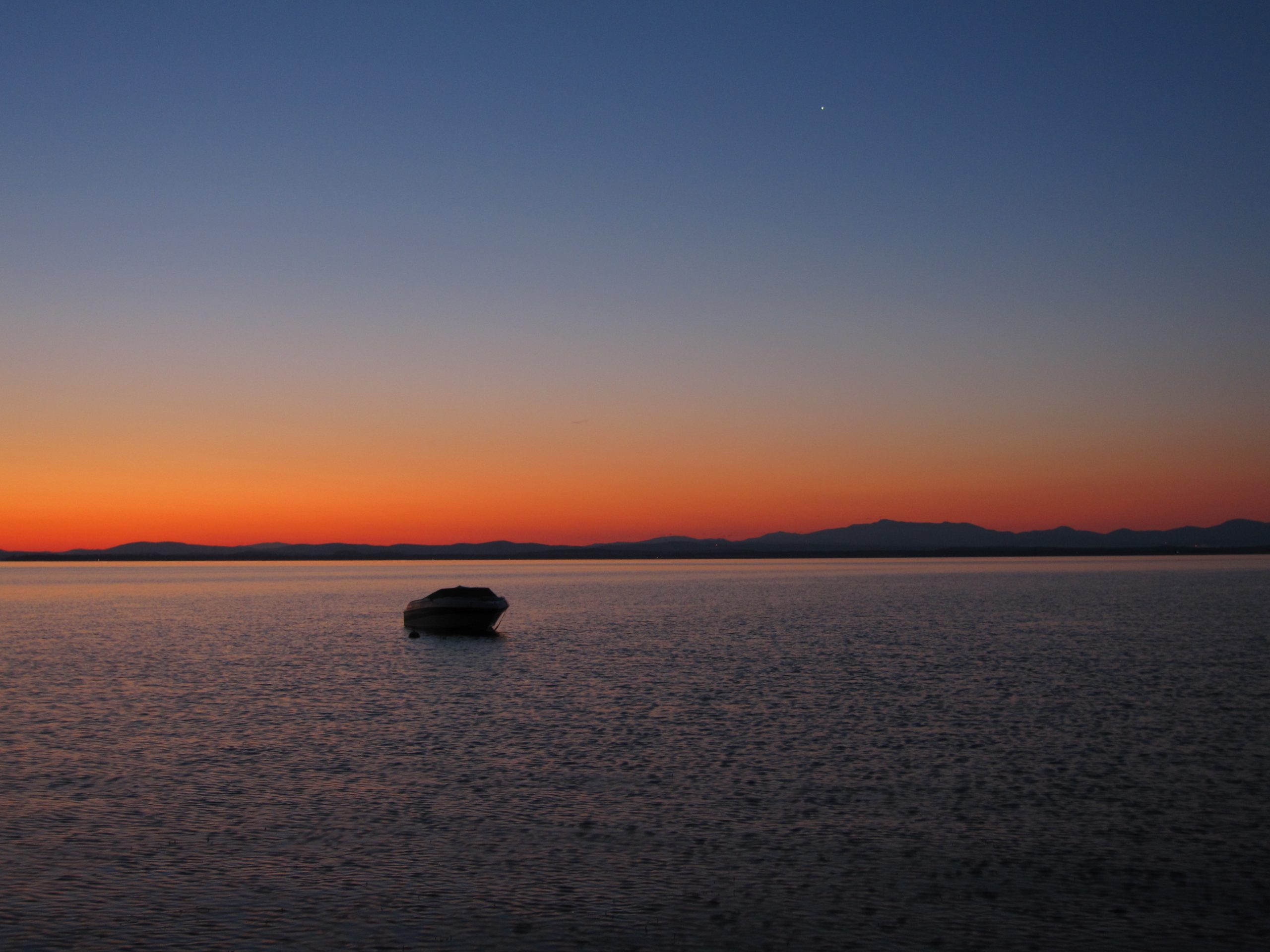 Lake Champlain at sunrise looking at vermont