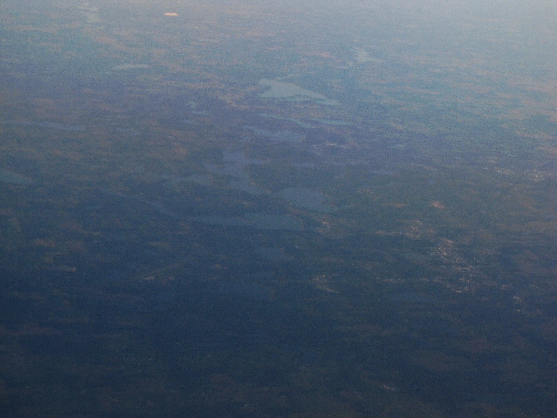 Aerial view of wooded lakes near Pokagon State Park and Angola