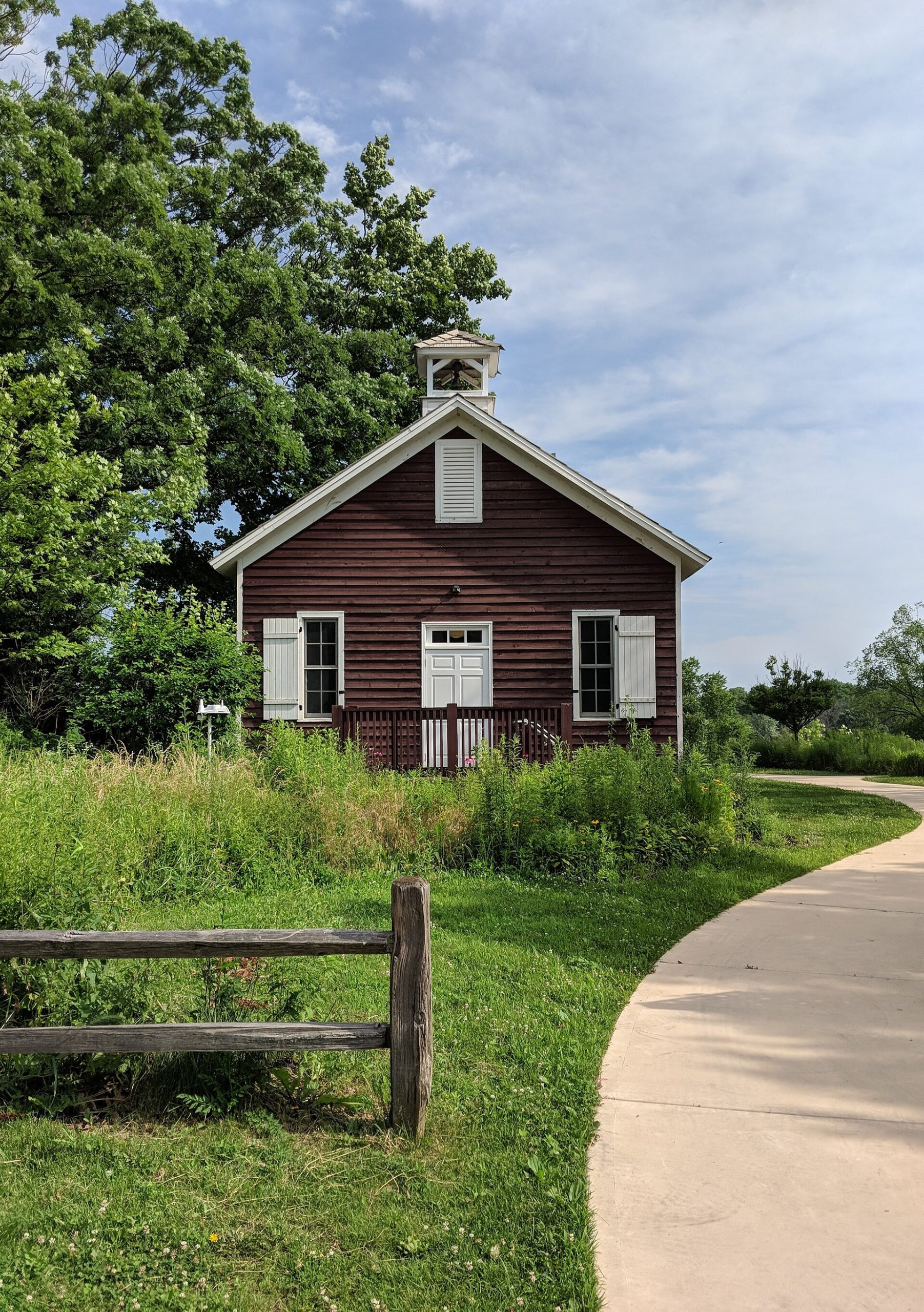 Little Red Schoolhouse Nature Center surrounded by woodland in the Palos preserves